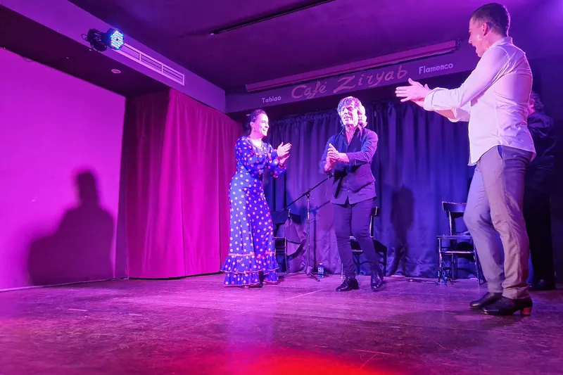 Flamenco performers clapping during a tablao in Madrid