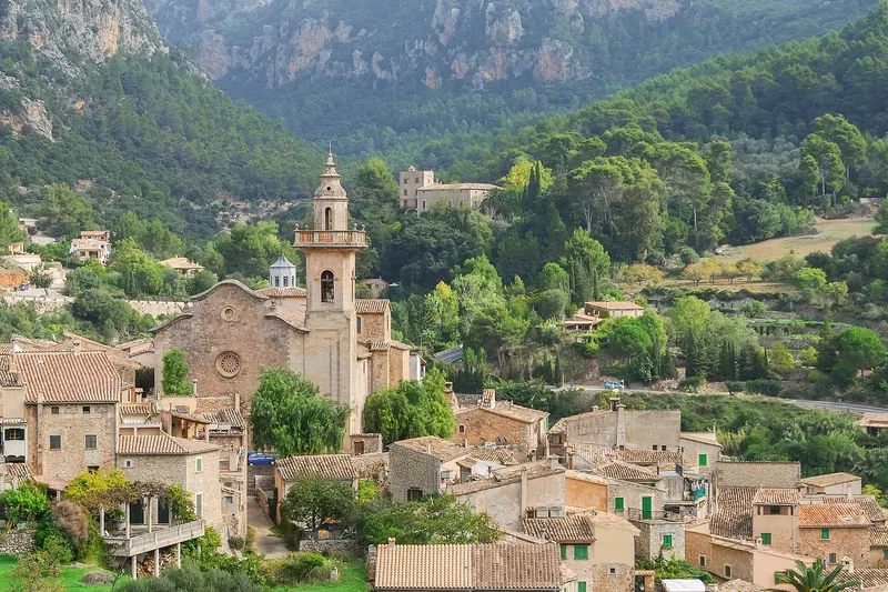 The honey-coloured village of Valldemossa on its terraced slope