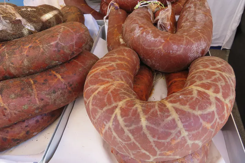 Cured sobrasada sausages hanging to age