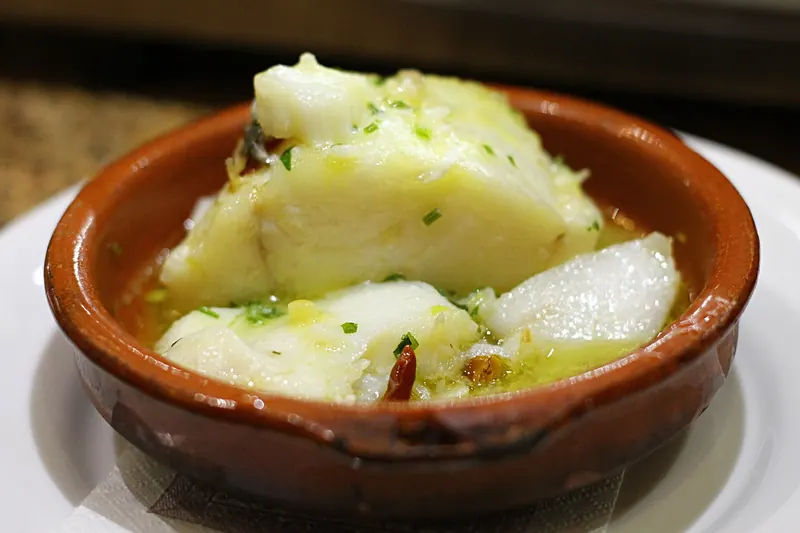 Salt cod in a pil-pil sauce of oil and garlic