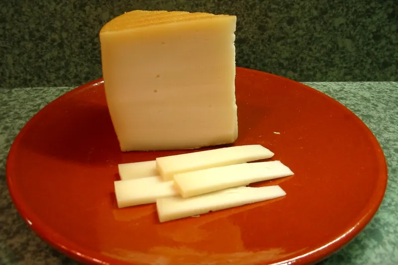A wedge of smoked Idiazabal sheep's cheese