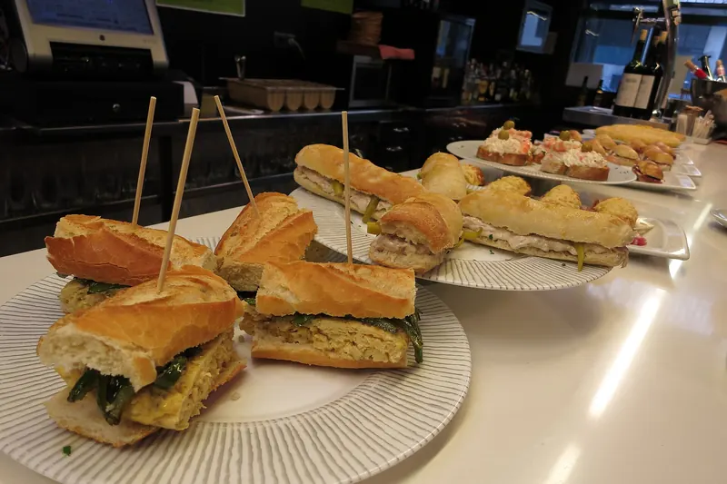 Pintxos laid out along a Basque bar counter