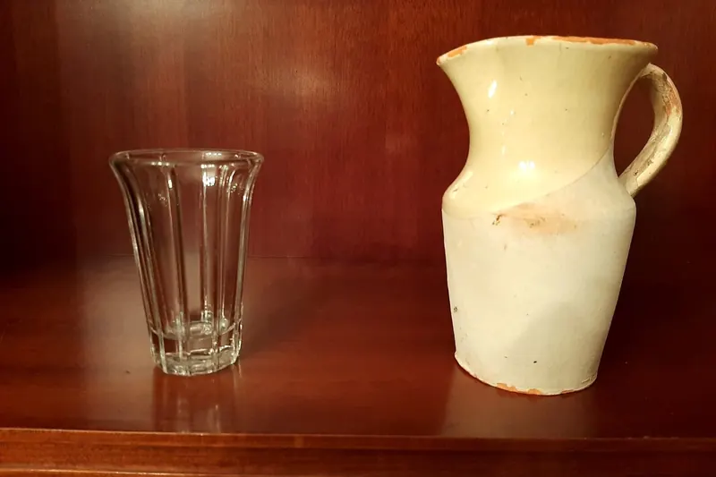 A jug and glass of txakoli
