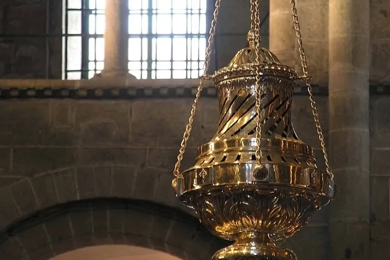The interior of Santiago Cathedral with the botafumeiro in flight