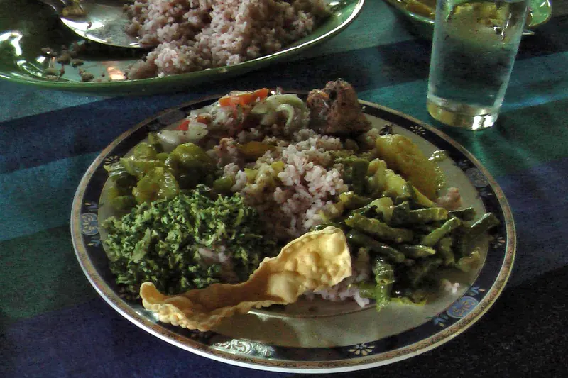 A Sri Lankan rice and curry meal with several small dishes