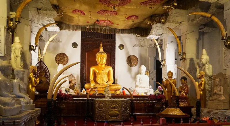 Sitting Buddha statues inside the Temple of the Tooth in Kandy