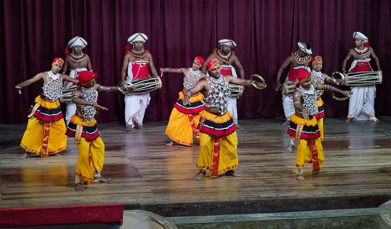 Dancers in costume performing a Kandyan dance
