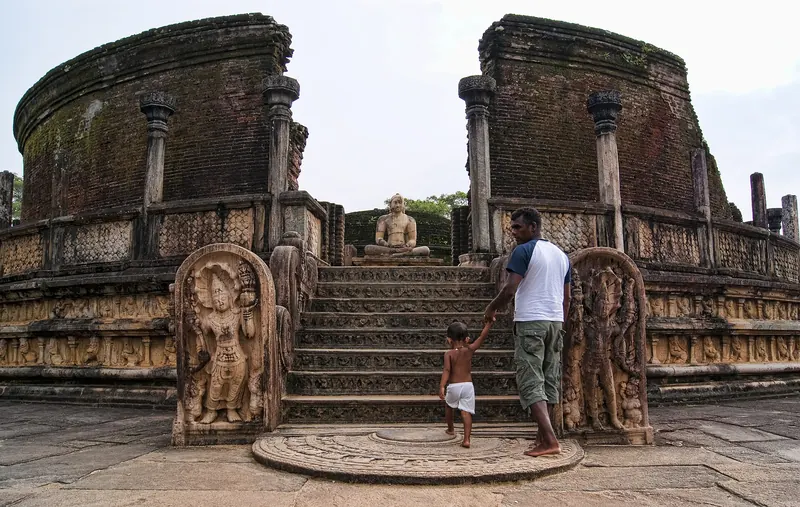 The circular Vatadage relic house with stone Buddhas in Polonnaruwa