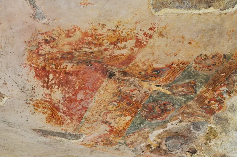 Painted frescoes of women on the rock face at Sigiriya