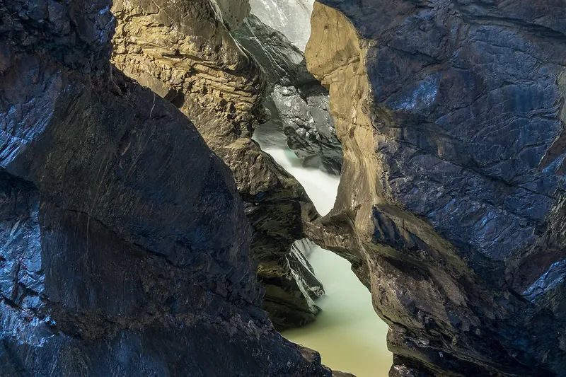 The Trümmelbach Falls rushing through a rock gorge