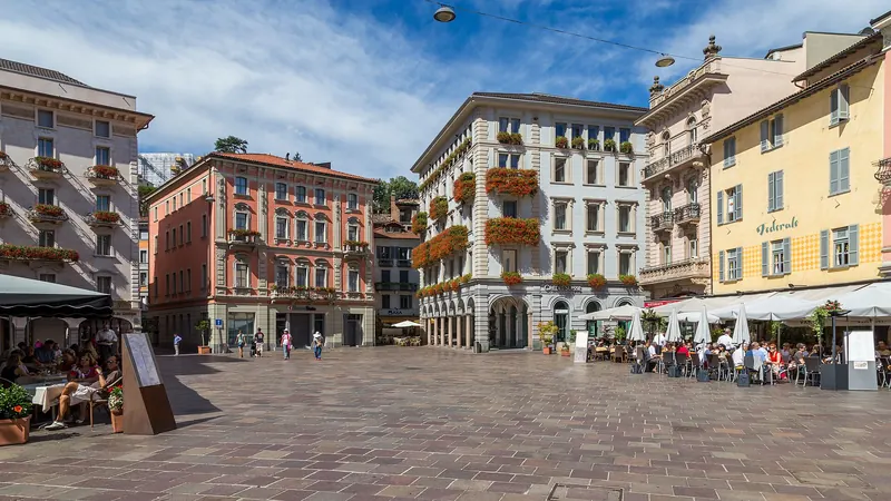 Piazza della Riforma with its cafés and arcaded buildings in Lugano
