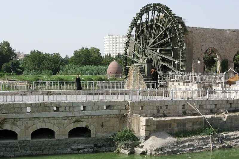 The wooden waterwheels of Hama turning in the Orontes River, photographed in 2008, before the war
