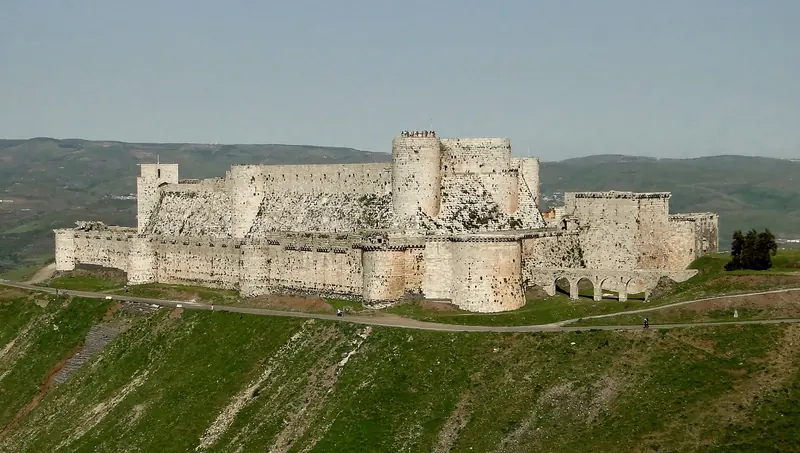 The walls and towers of Krak des Chevaliers on its hilltop, photographed in 2010, before the war