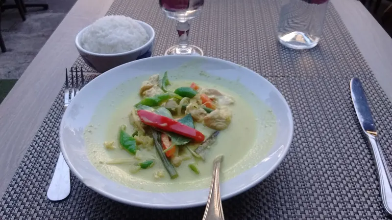 A bowl of Thai green curry with chicken