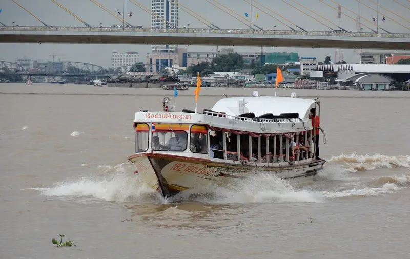 A Chao Phraya Express Boat ferry crossing the river in Bangkok