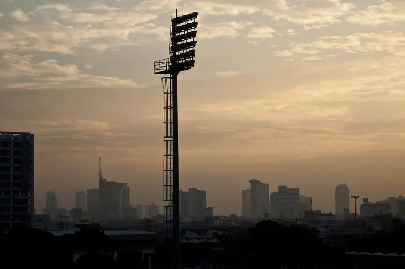 The Bangkok skyline seen at sunset from a rooftop bar