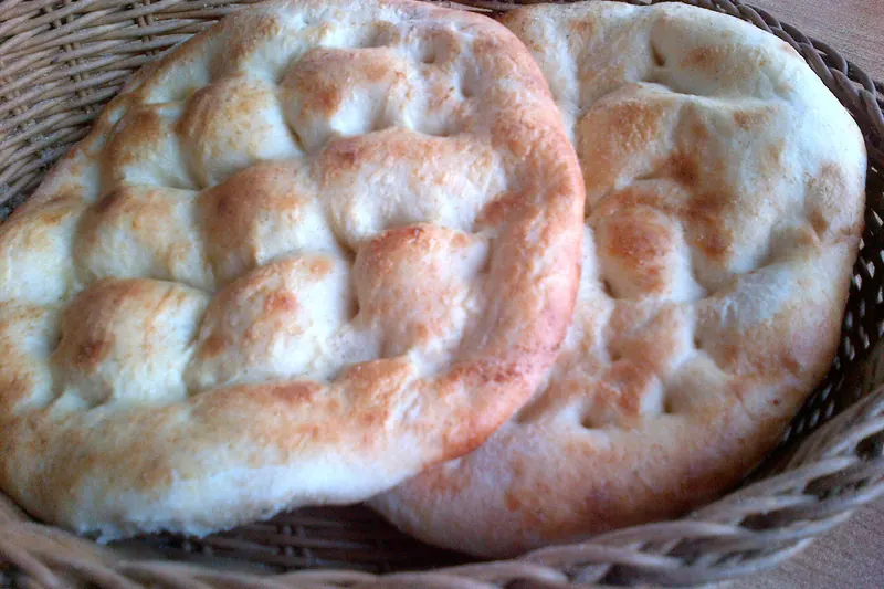 Boat-shaped pide baked with cheese and egg