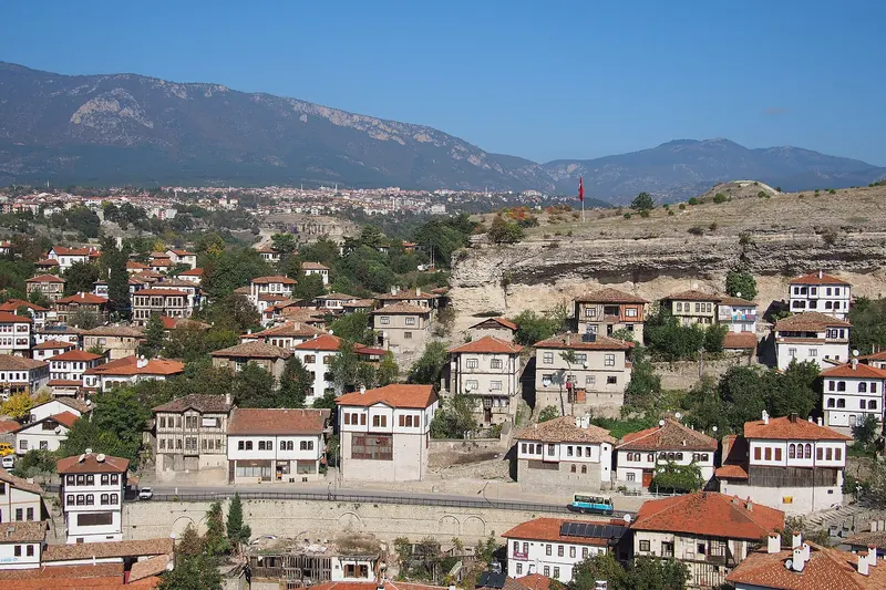 White timber-framed Ottoman houses stacked on a hillside in Safranbolu