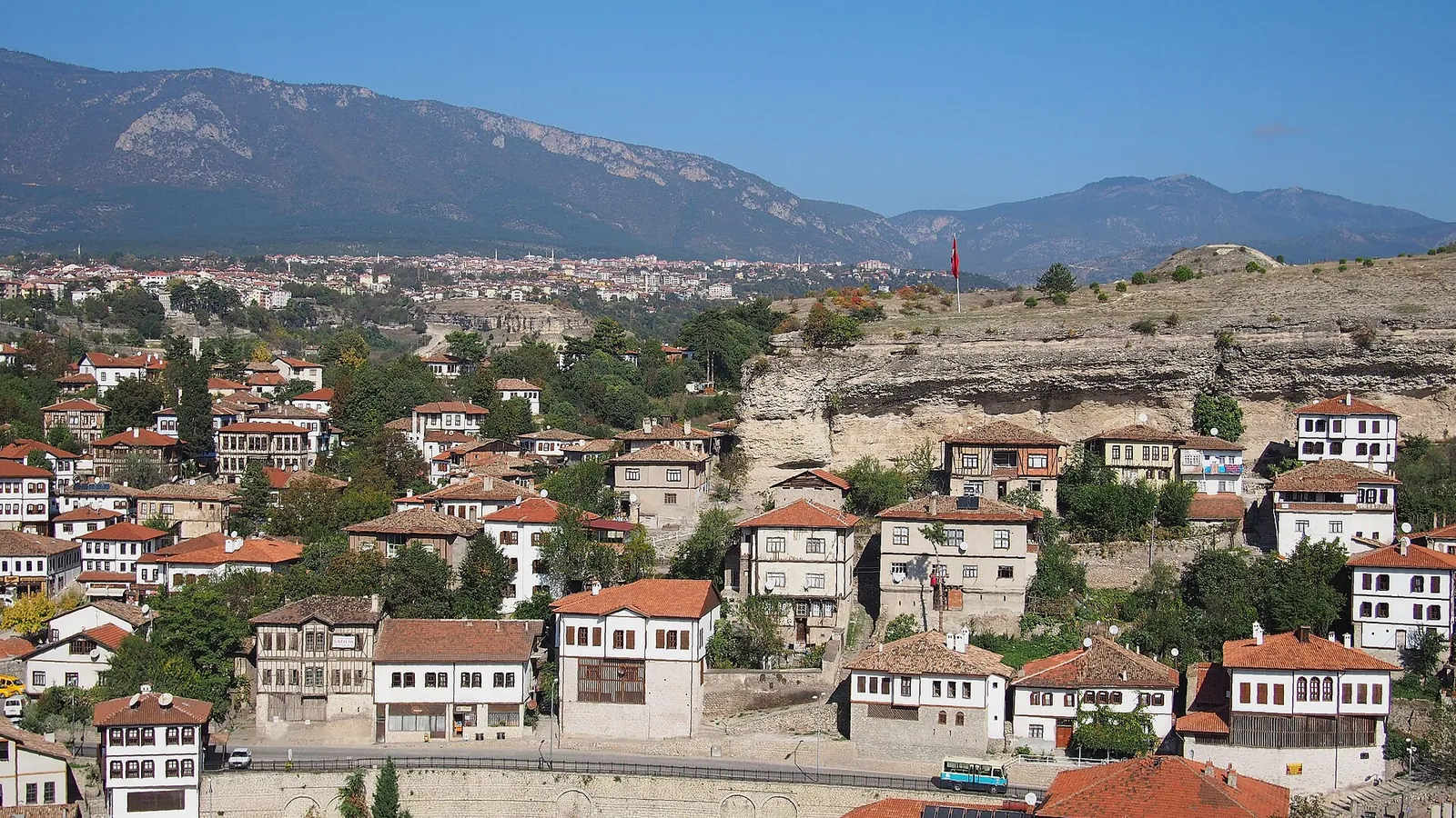 White timber-framed Ottoman houses stacked on a hillside in Safranbolu