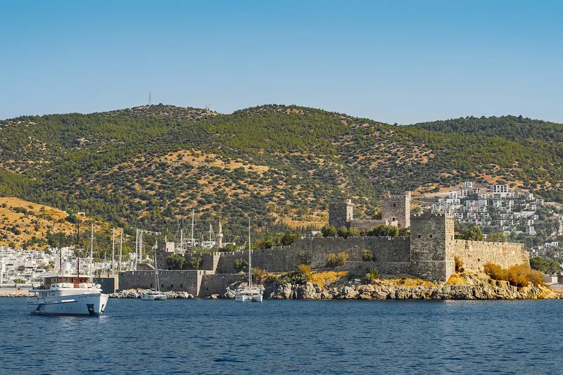 The Castle of St Peter standing on its headland above Bodrum's harbour and yachts