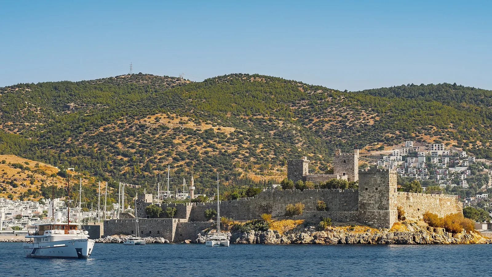 The Castle of St Peter standing on its headland above Bodrum's harbour and yachts