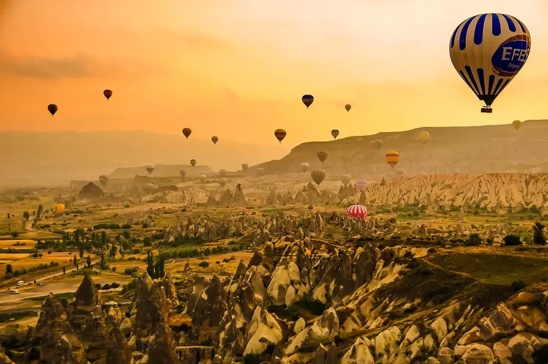 Balloons drifting over the valleys of Cappadocia
