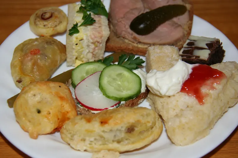 A traditional afternoon tea with scones, jam and clotted cream