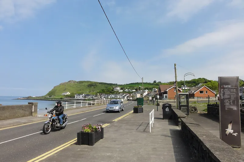 The Antrim Coast Road running along the sea front
