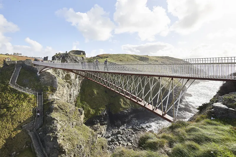The modern footbridge linking Tintagel Castle's headland to the mainland