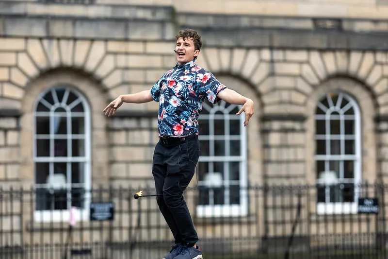 A street performer entertaining crowds during the Edinburgh Fringe