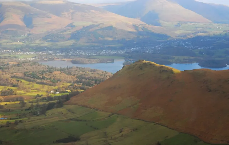 An aerial view of Keswick and Derwentwater surrounded by fells