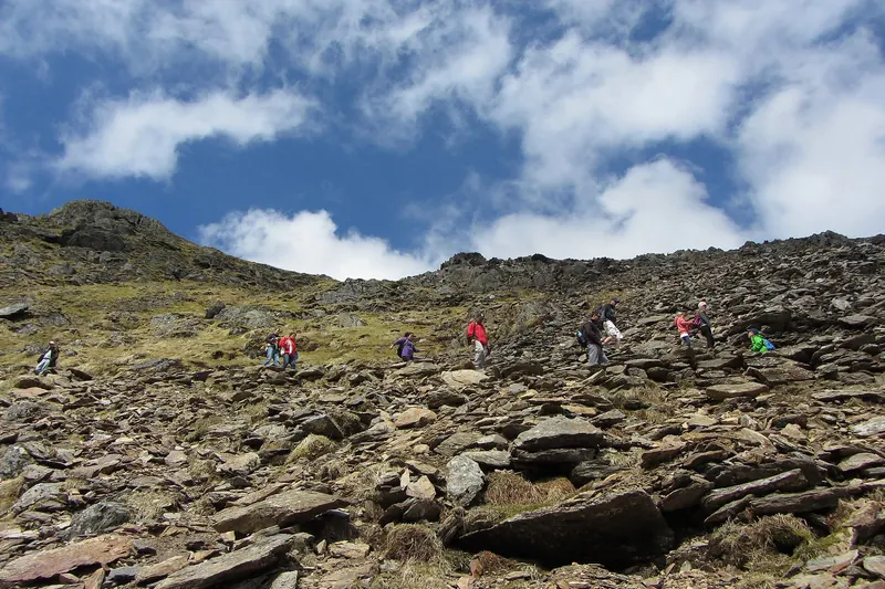 Walkers on the Pyg Track heading up Yr Wyddfa