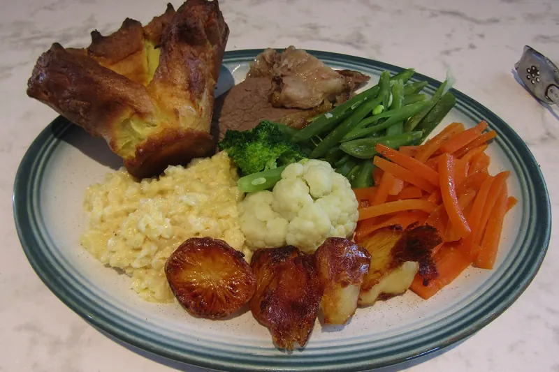 A roast dinner with a large Yorkshire pudding