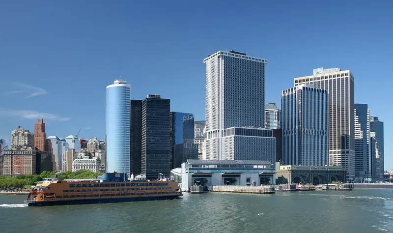 An orange Staten Island Ferry at its terminal