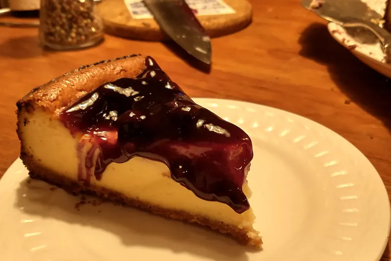 A slice of dense New York cheesecake