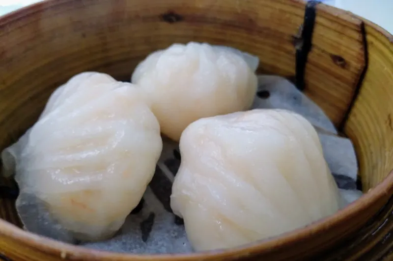 An assortment of dim sum dishes in bamboo steamers