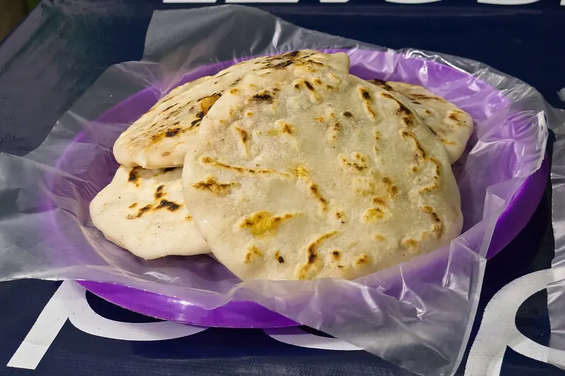 Pupusas, thick stuffed corn flatbreads