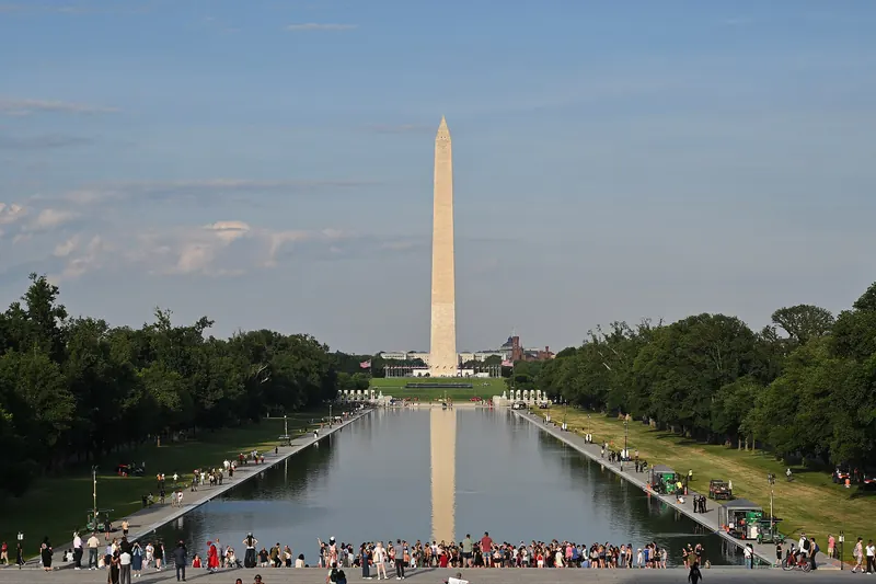 The Lincoln Memorial reflected in the long rectangular pool on the National Mall