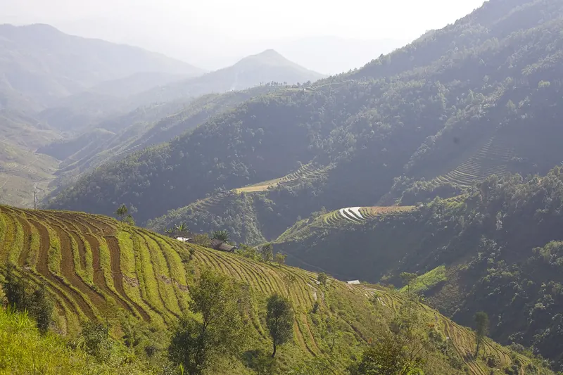 A road winding through the mountains of the Ha Giang Loop in northern Vietnam