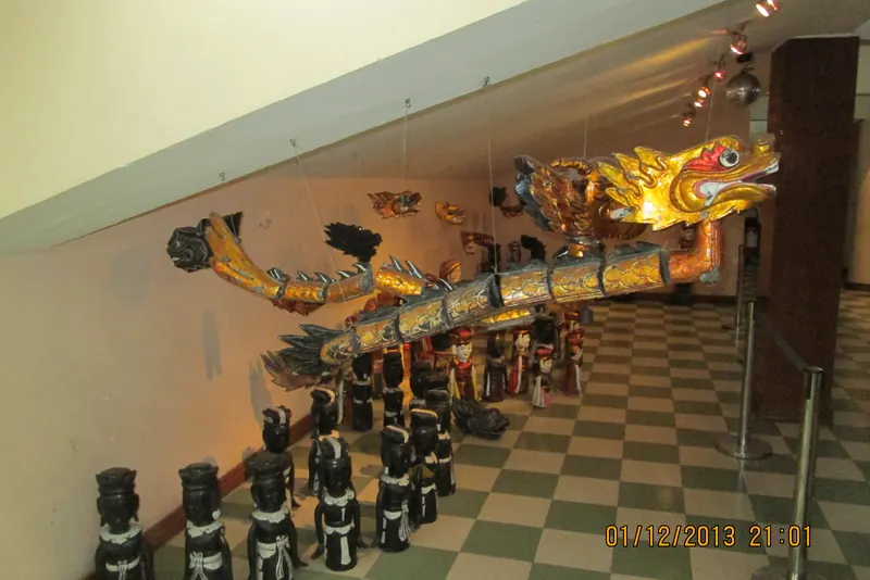 Wooden puppets performing on the water stage at the Thang Long Water Puppet Theatre in Hanoi