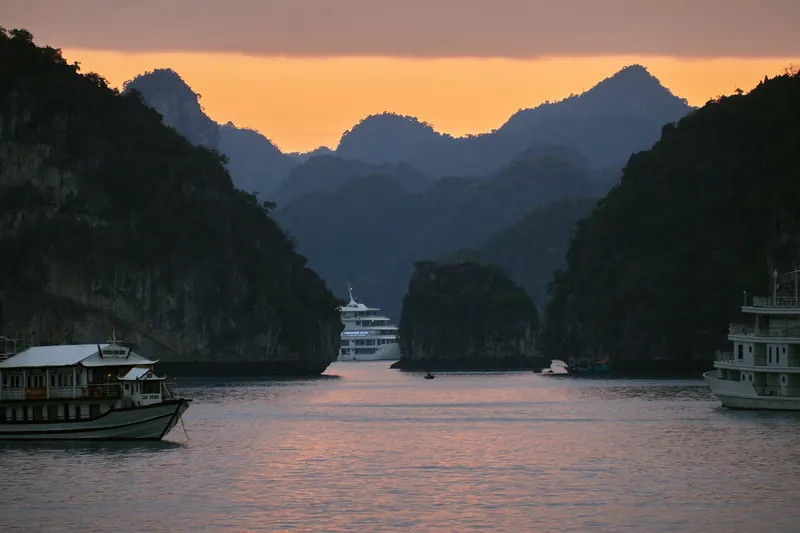 Limestone karst islands rising from the green waters of Ha Long Bay