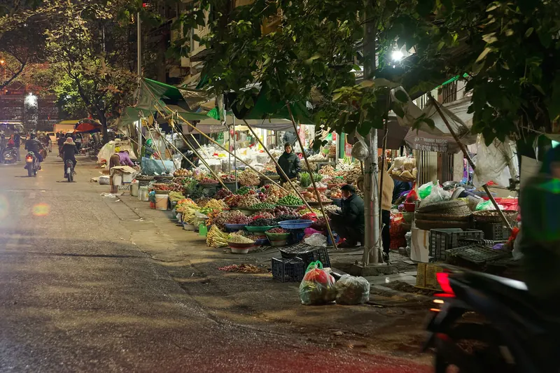 A busy evening market in the Old Quarter of Hanoi