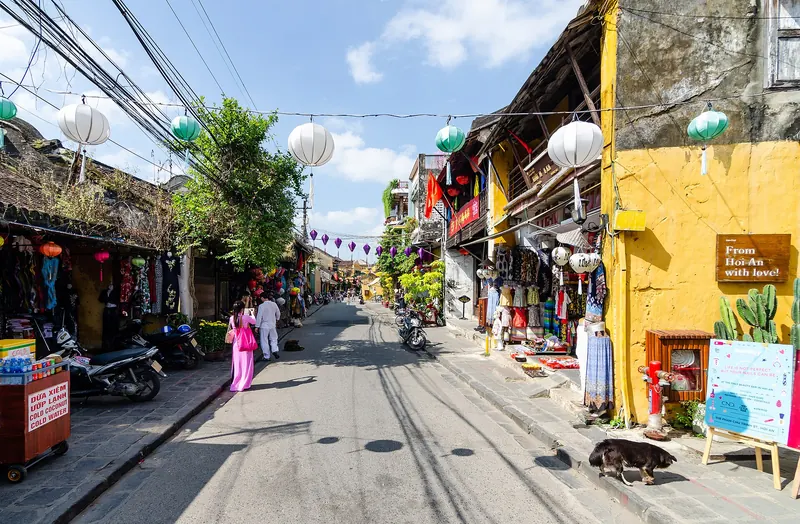 Yellow-walled houses and hanging lanterns in the ancient town of Hoi An