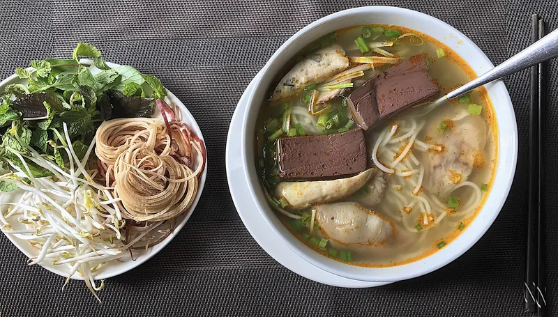 A bowl of spicy Hue-style beef noodle soup