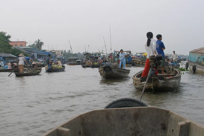 Boats loaded with fruit and vegetables at a floating market near Can Tho