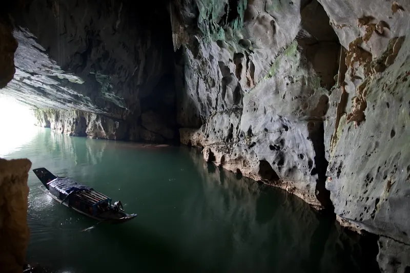 The entrance to Phong Nha Cave on the river with boats